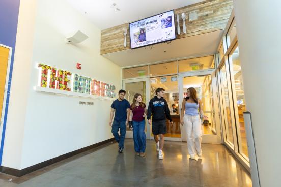 Group of students walk out of the Kitchens