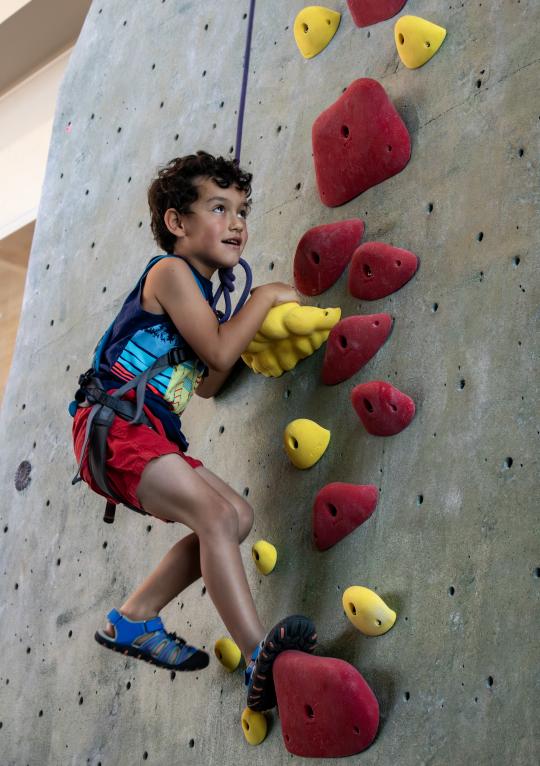 Sibling at rock climbing