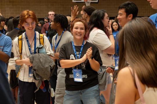 A crowd of students socialize in the Recreation Center