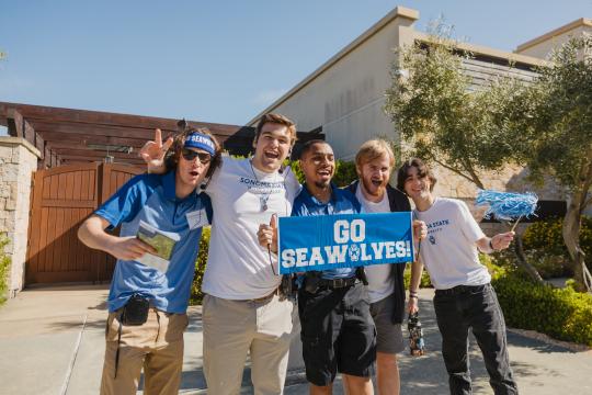 Group of Student Tour Guides cheering.